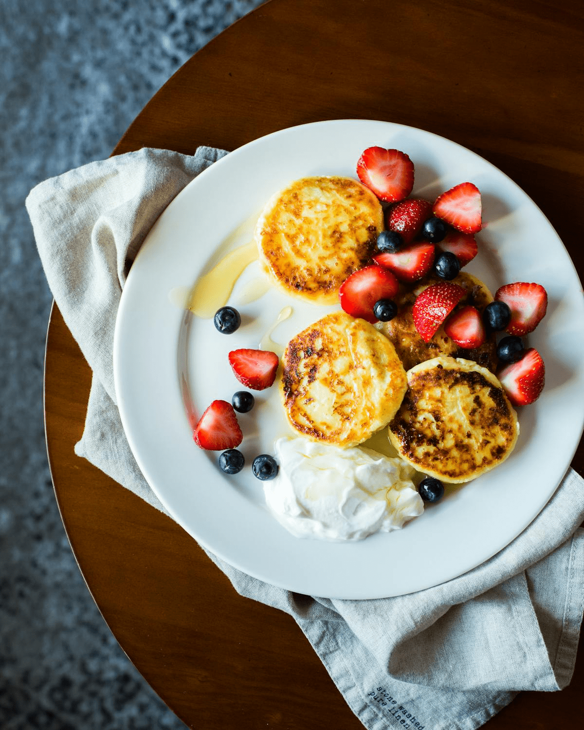 breakfast plate with fruit yogurt and muffins