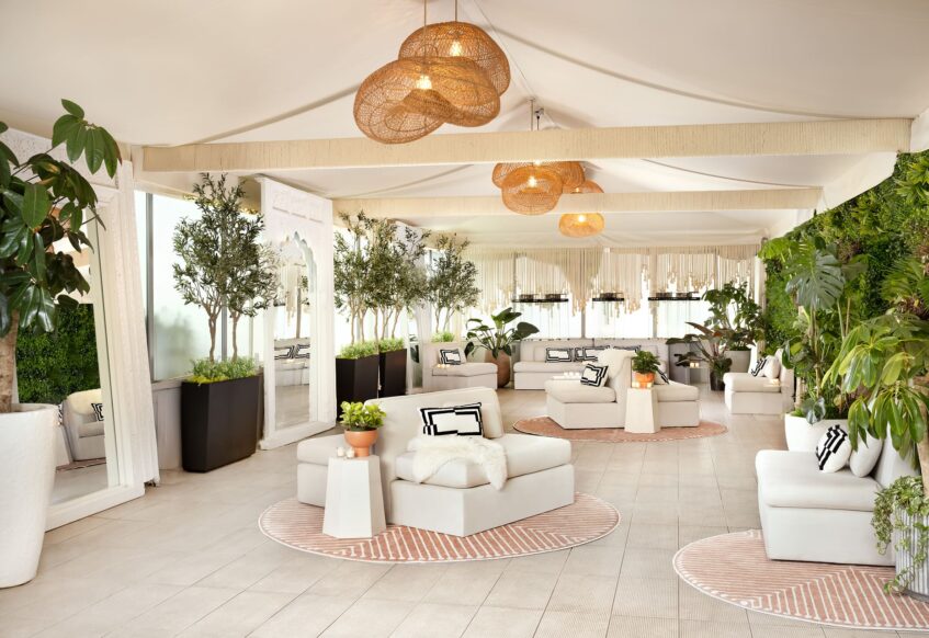 Outdoor terrace with greenery and lounge seating