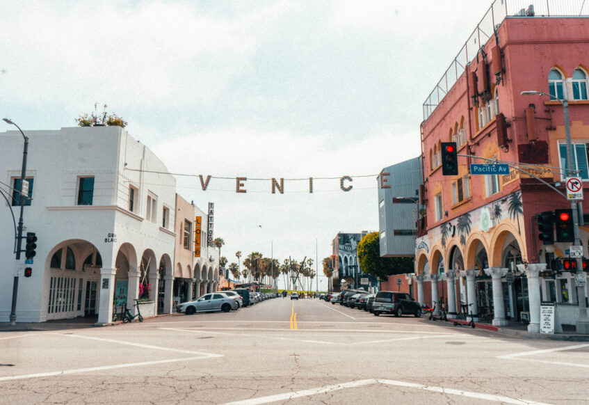 Iconic Venice Beach sign over Pacific Avenue intersection.