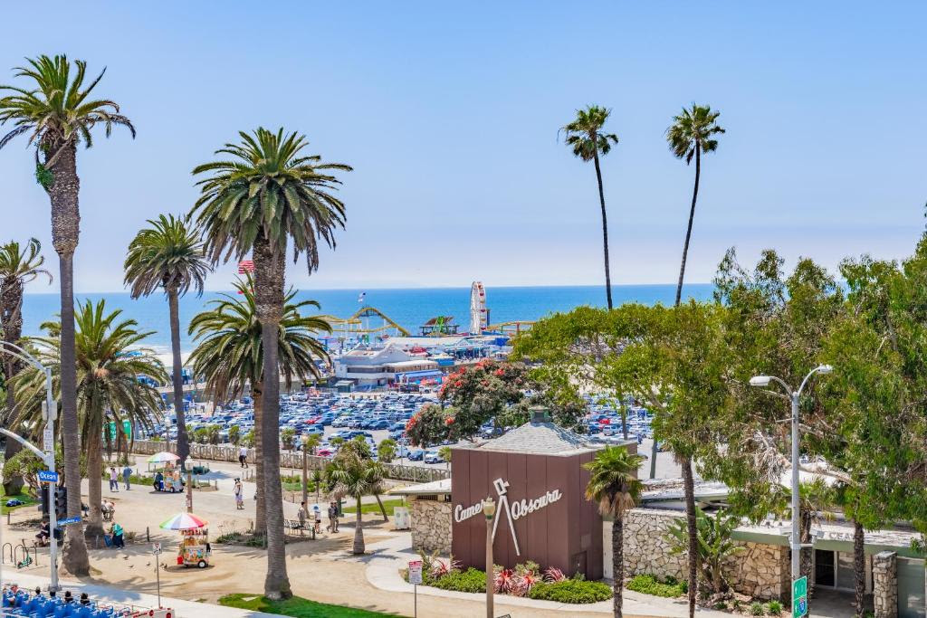 Santa Monica Pier entrance with palm trees.