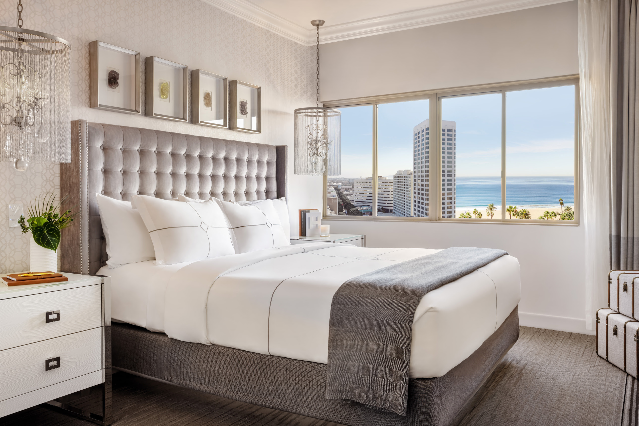 Bright bedroom with ocean view through large windows
